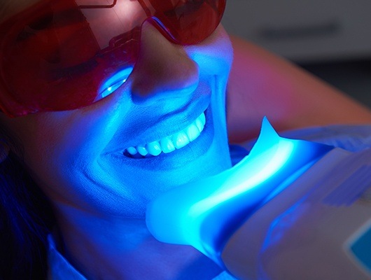 woman doing teeth whitening