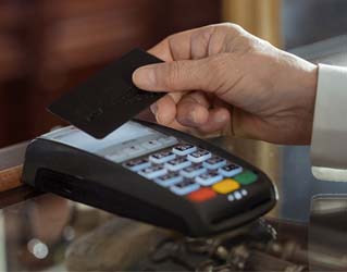 Hand holding credit card for payment