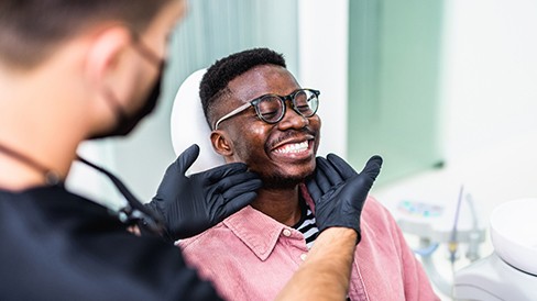 Man smiling at the dentist