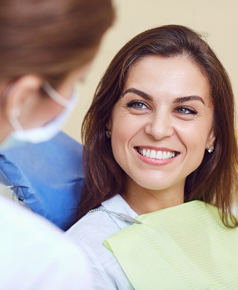  A woman smiling at her dentist