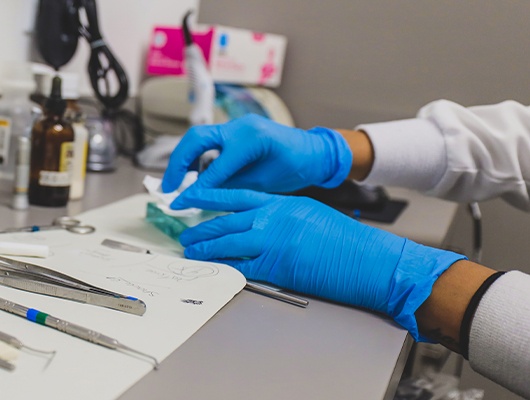 dentist working on dentures in lab