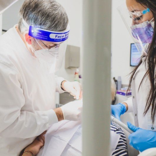 Dr. Kulick working on patient with assistant