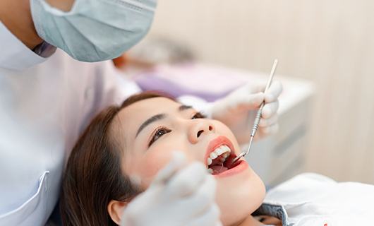 woman at dental checkup for cost of emergency dentistry in Coral Springs 