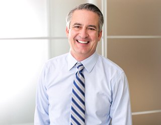 smiling businessman in his office