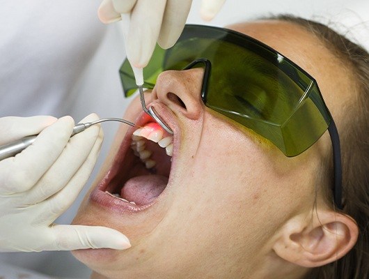 woman having laser periodontal therapy done