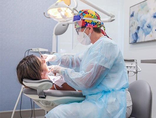 dentist performing dental checkup