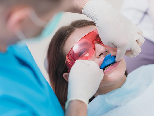 girl getting fluoride treatment