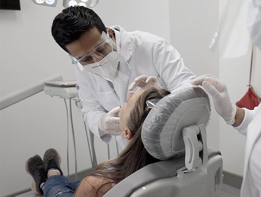 dentist checking womans smile
