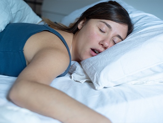 woman laying on stomach asleep