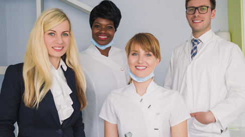 Dental team members smiling 