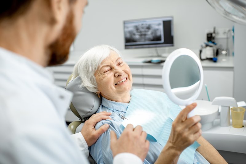 Elderly woman receiving dental implants