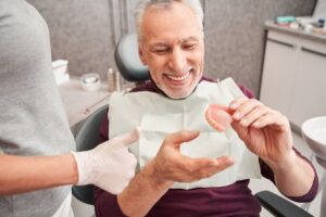 Man with dentures at his dental checkup