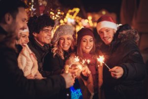 five young adults celebrating happy new year